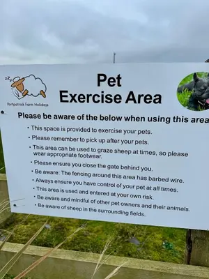 a sign for a pet exercise area at Ardbeg 4 - Farm Stay with Sea Views across to Northern Ireland in Stranraer