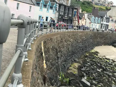 a view of a bridge with people standing on the street at Ardbeg 4 - Farm Stay with Sea Views across to Northern Ireland in Stranraer