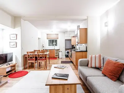 a living room with a couch and a table at Sharrow View in Watermillock