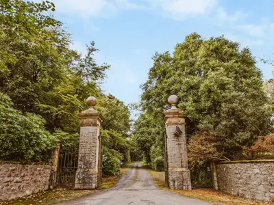a gate at the end of a road at Coachman in Enoch