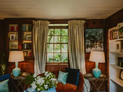 a living room with a couch and a window at Coachman in Enoch