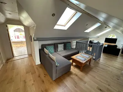 a living room with a couch and a table at Borrowdale View in Keswick