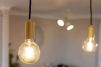 a group of three light bulbs hanging from a ceiling at Waverley Suite No57 - Donnini Apartments in Ayr
