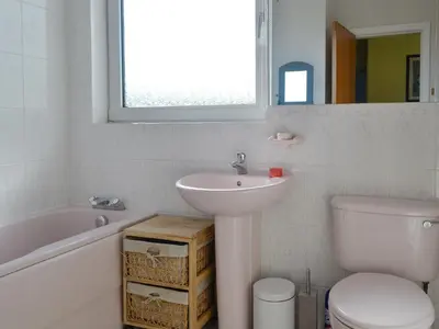 a bathroom with a sink and a toilet and a bath tub at Bel-Mar in Whithorn