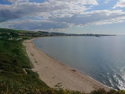 a view of a beach and the water at Honesty Cottage in Girvan