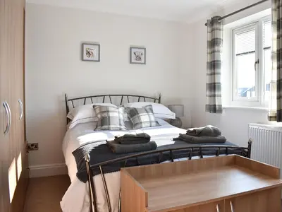 a bedroom with a bed with pillows on it at Chapel House in Dearham