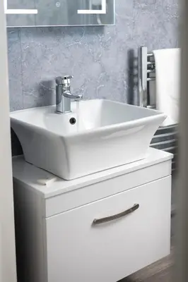 a white sink on top of a white cabinet in a bathroom at Four Oaks House in Carlisle