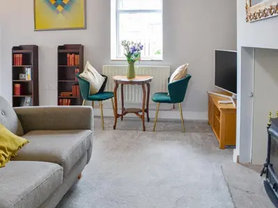a living room with a couch and chairs and a table at Old Reading Room in Cotehill
