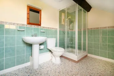 a bathroom with a toilet and a sink and a shower at Meadow View Chapel Stile in Chapel Stile