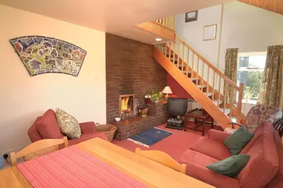 a living room with a couch and a fireplace at Church Bank in Chapel Stile