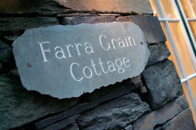 a stone sign on the side of a building at Farra Grain, Little Langdale in Little Langdale