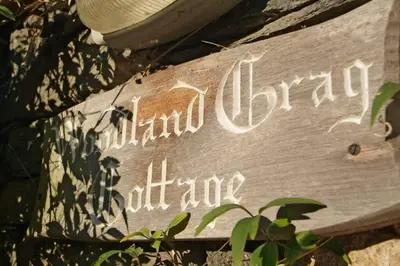 a sign that says island detention initiative on a wall at Woodland Crag Cottage, Grasmere in Grasmere