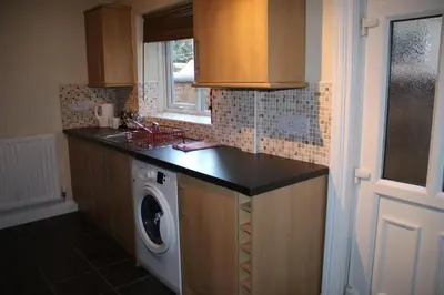 a kitchen with a washer and a washing machine at Carvetii - Quentin House - Near Hospital, max 7 ppl in Carlisle