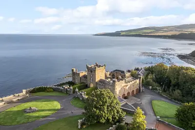 an aerial view of a castle by the water at Ardlochan Lodge - Culzean Castle in Maybole