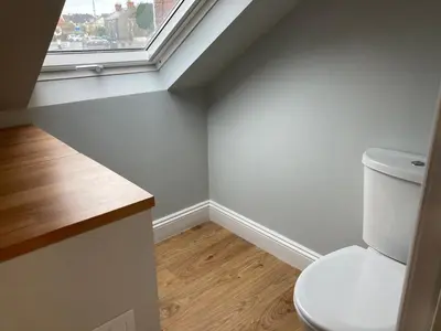 a bathroom with a toilet and a window at The Annex in Carlisle