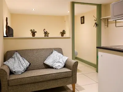 a living room with a couch with two pillows at Danika East in Threlkeld