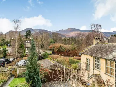 an aerial view of a home with mountains in the background at The Plosh in Keswick