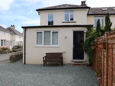 a bench sitting in front of a house at Fell View in Keswick