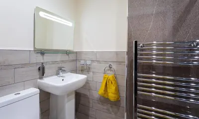 a bathroom with a sink and a mirror at Dovedale in Keswick