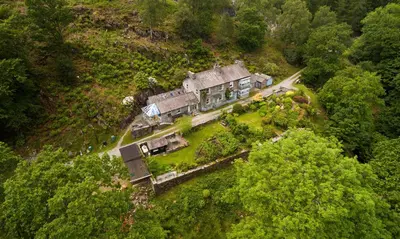 an aerial view of a house on a hill at Oakbank in Elterwater