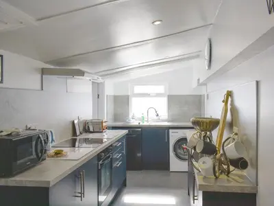 a kitchen with a sink and a stove at Ludlow Bank in Coulderton