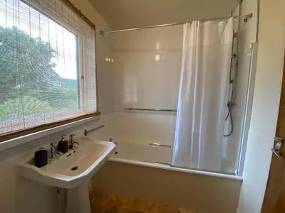 a bathroom with a sink and a shower at Craignair in Port William