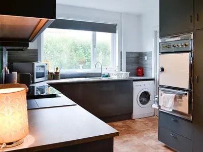 a kitchen with a sink and a dishwasher at Craignair in Port William