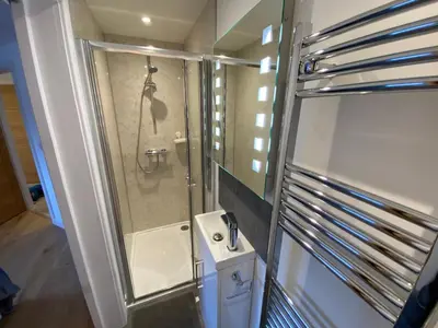 a bathroom with a shower and a sink at Latrigg View in Keswick