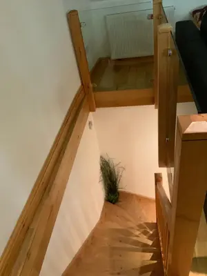a stairway with a plant in the middle at Dove Cottage (Annex) in Workington
