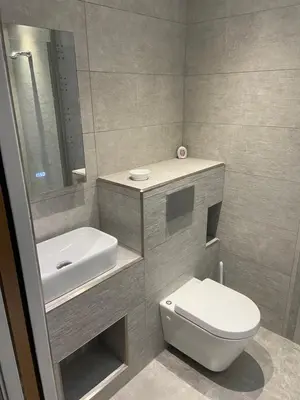 a bathroom with a white toilet and a sink at Kirkwirral Bed & Breakfast in Dumfries