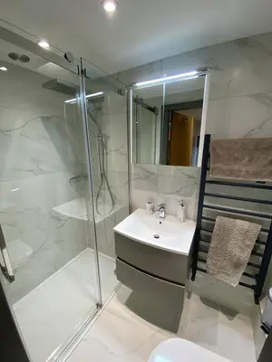 a bathroom with a sink and a shower at holidayhomemoffat,com (Stable Cottage) in Moffat