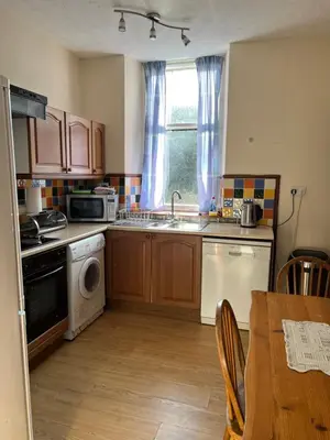 a kitchen with a sink and a dishwasher at The Maid's House in Lanark