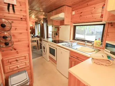a kitchen in a tiny house with a sink at Squirrels Leap in Keswick