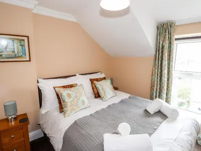a bedroom with a bed and a window at Oakhurst in Keswick