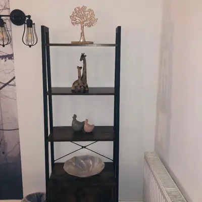a shelf with a hat and a tree on it at The Coop in Castle Douglas