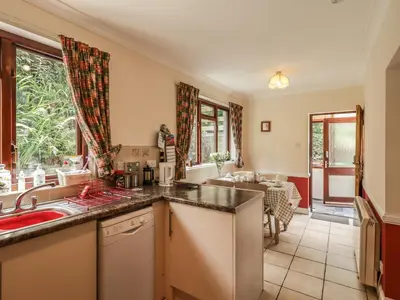 a kitchen with a sink and a counter top at Wood End in Dalbeattie