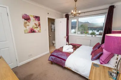 a bedroom with a bed and a window at Appletree in Portinscale