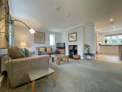 a living room with a couch and a tv at Causey View in Braithwaite