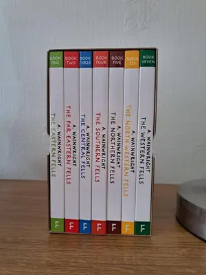 a group of books sitting on top of a table at Byways in Keswick