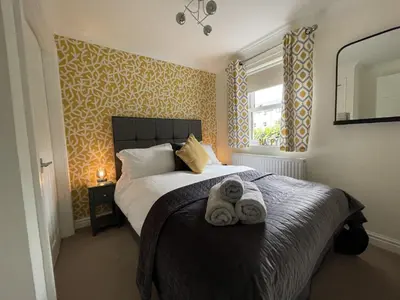 a bedroom with a bed with towels on it at Maiden Moor in Keswick