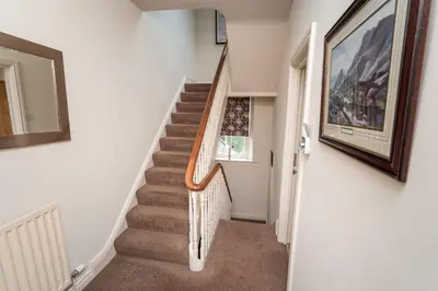 a staircase in a house with a picture on the wall at Crandy Nook in Keswick