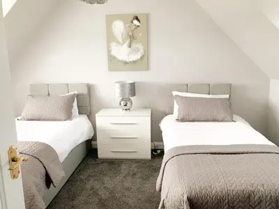 two beds sitting next to each other in a bedroom at Float bay view in Stranraer