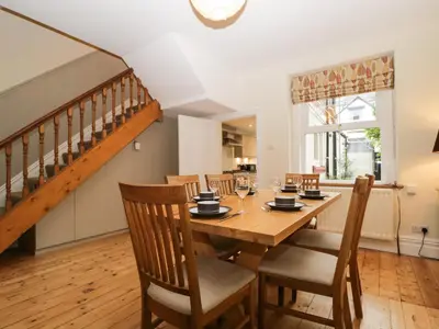 a dining room with a wooden table and chairs at Shields in Keswick