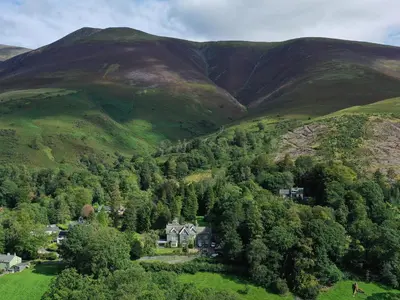 an aerial view of a house in the mountains at Norton in Keswick