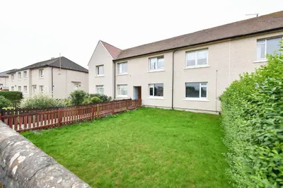 an empty yard in front of a house at Greensleeves Place in Troon