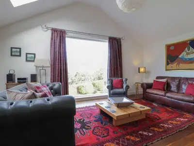 a living room with two couches and a coffee table at Cloud End in Keswick