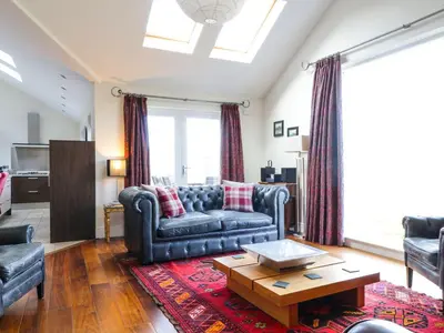 a living room with a couch and a coffee table at Cloud End in Keswick
