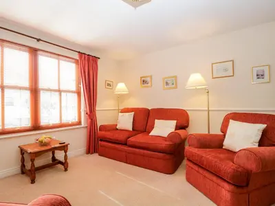 a living room with two chairs and a couch at Derwent Haven in Keswick