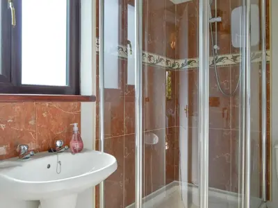 a bathroom with a sink and a shower at High Mains in Winscales