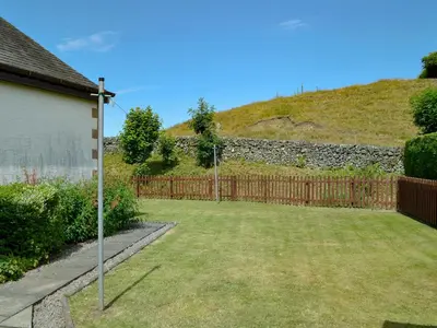 a yard with a fence and a hill at Westlin in Penpont